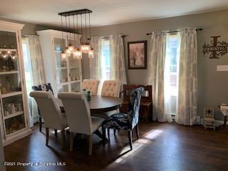 320 Village Road Dallas, PA 18612 - Photo 8 of 29 a view of a dining room with furniture window and wooden floor