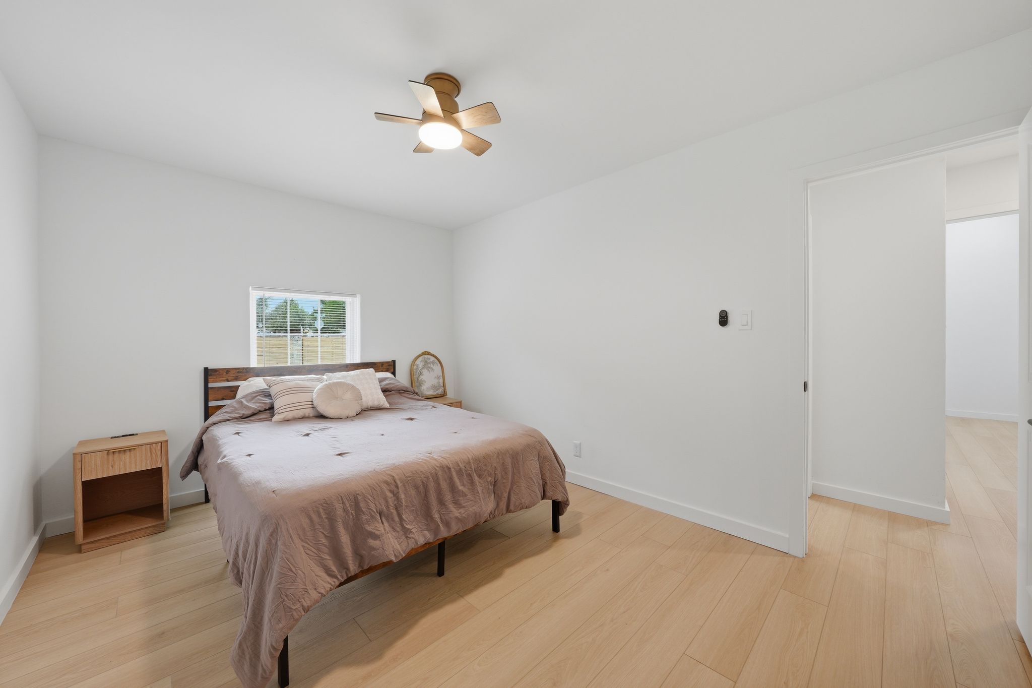 6804 Meadow Run Austin, TX 78745 - Photo 19 of 34 a bedroom with a bed and a chandelier