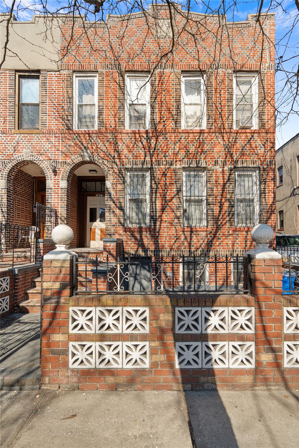 a front view of a building with parking