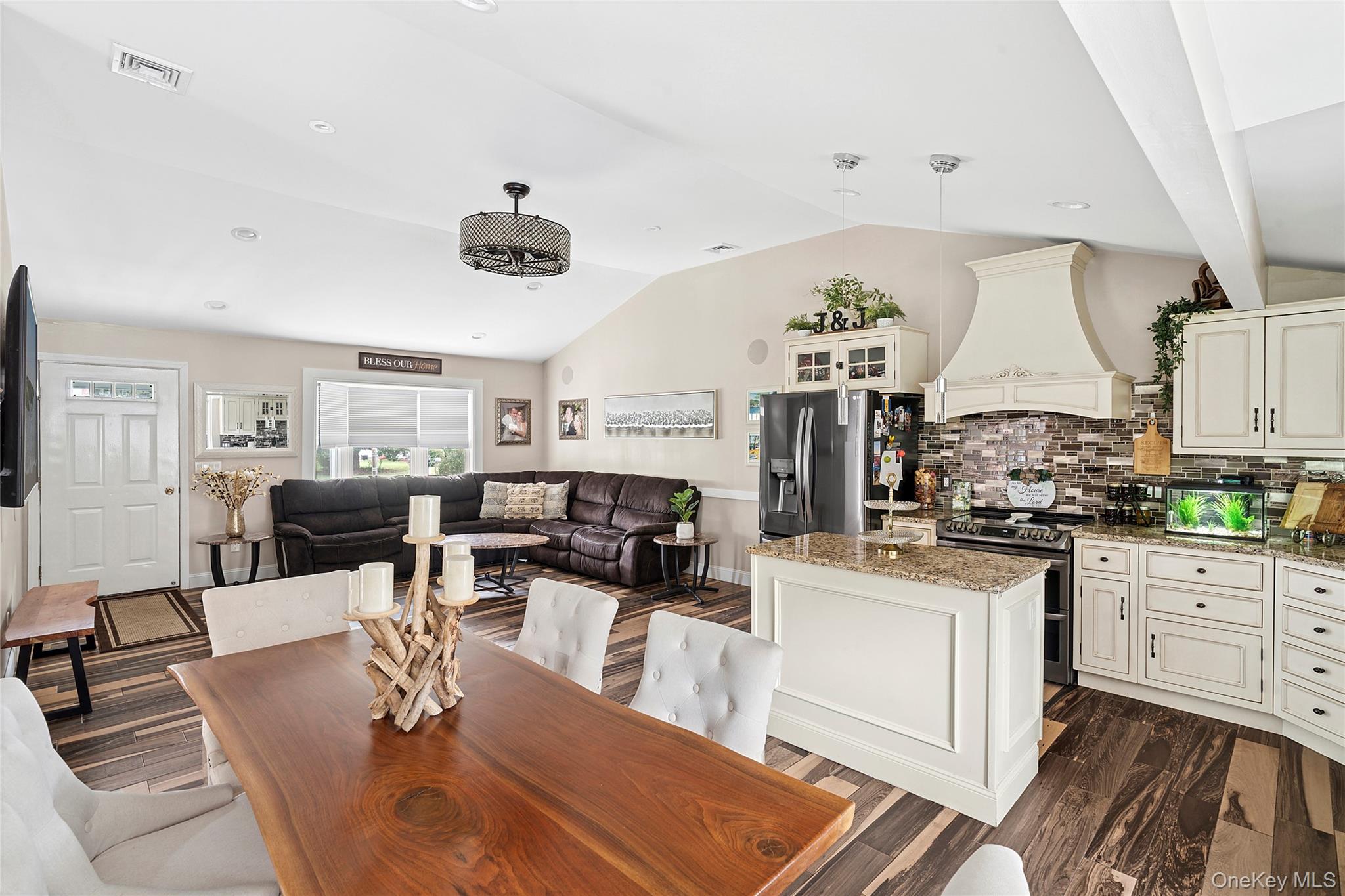 53 Timber Drive Calverton, NY 11933 - Photo 12 of 20 a kitchen with stainless steel appliances granite countertop a stove and white cabinets