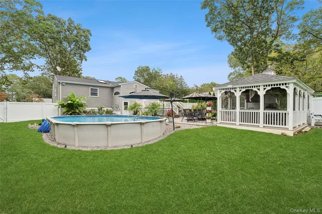 a front view of house with yard and seating area