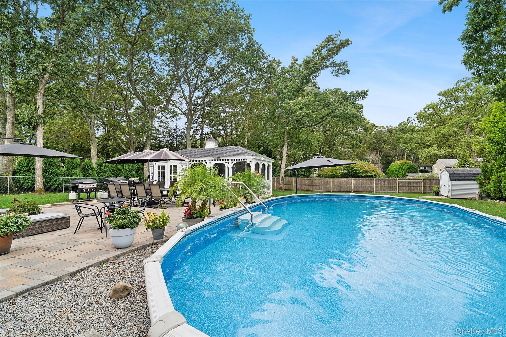 53 Timber Drive Calverton, NY 11933 - Photo 18 of 20 a view of a swimming pool with a patio