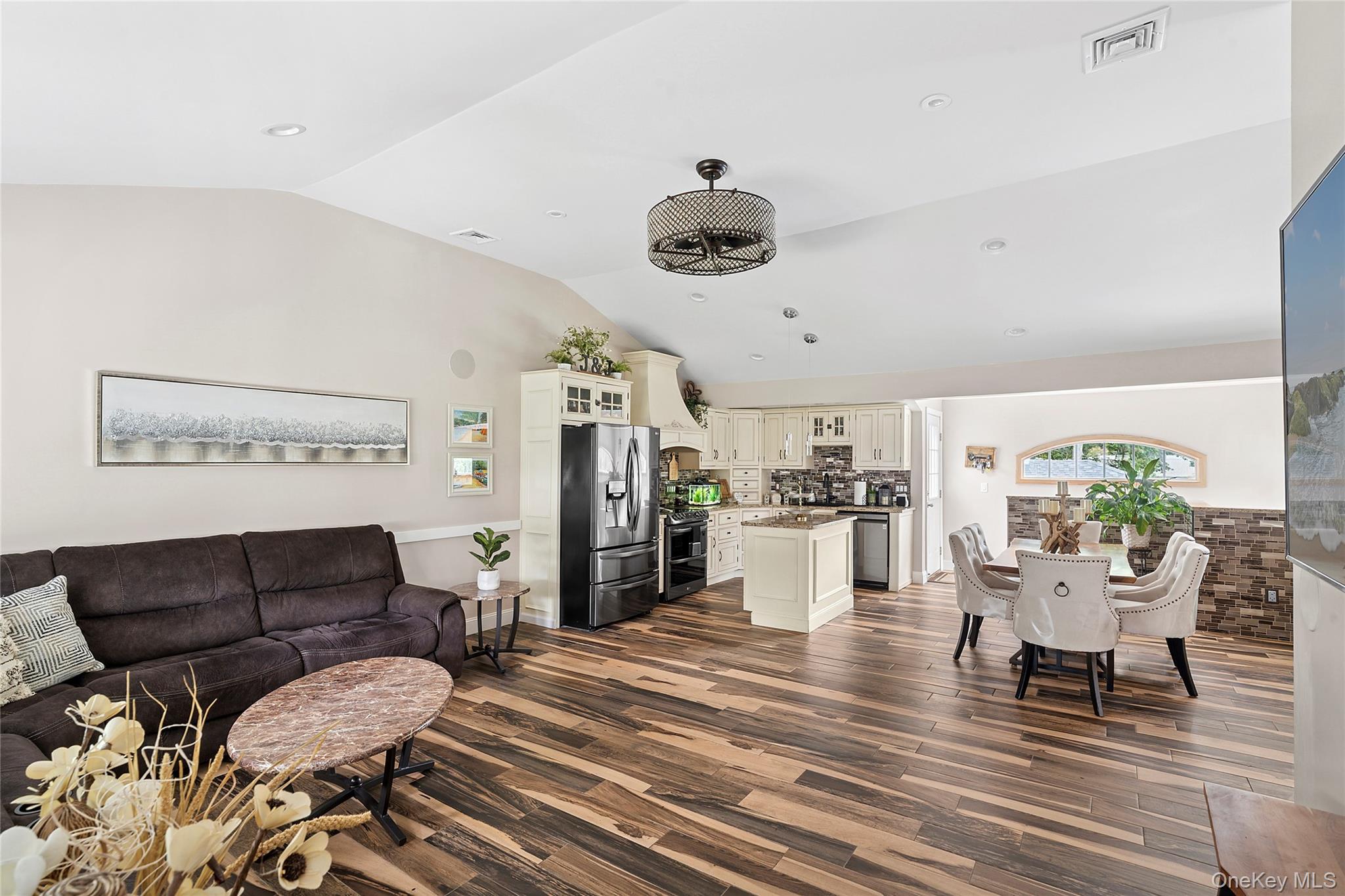 53 Timber Drive Calverton, NY 11933 - Photo 3 of 20 a living room with furniture and a dining table