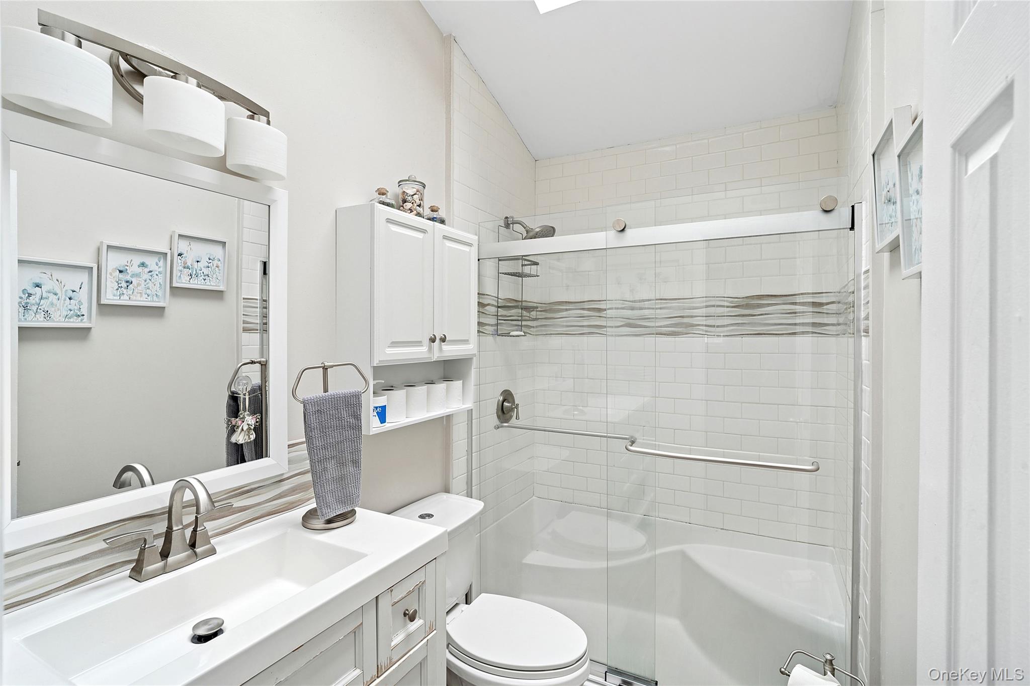 53 Timber Drive Calverton, NY 11933 - Photo 7 of 20 a bathroom with a sink toilet and shower