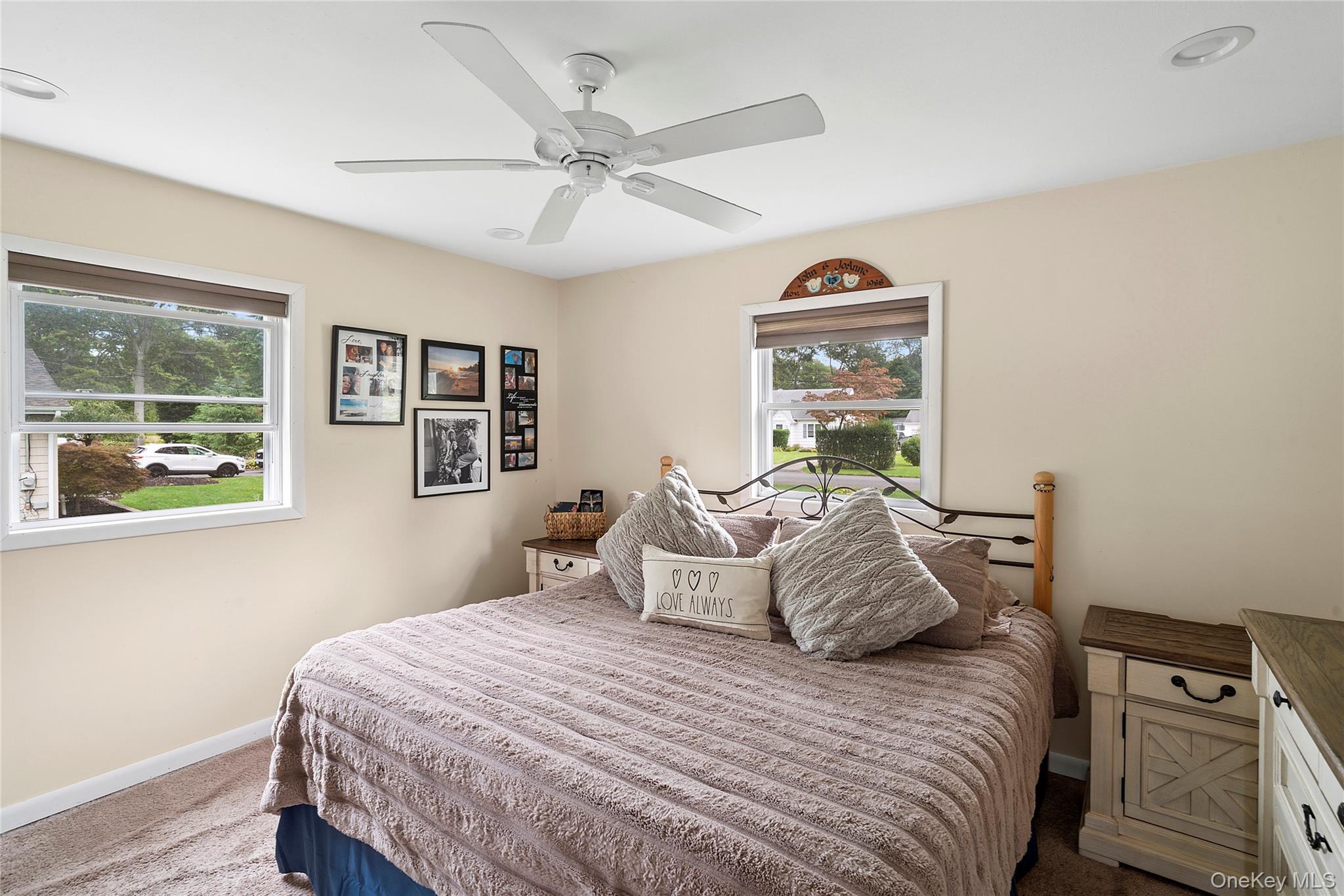 53 Timber Drive Calverton, NY 11933 - Photo 8 of 20 a bedroom with a bed and a window