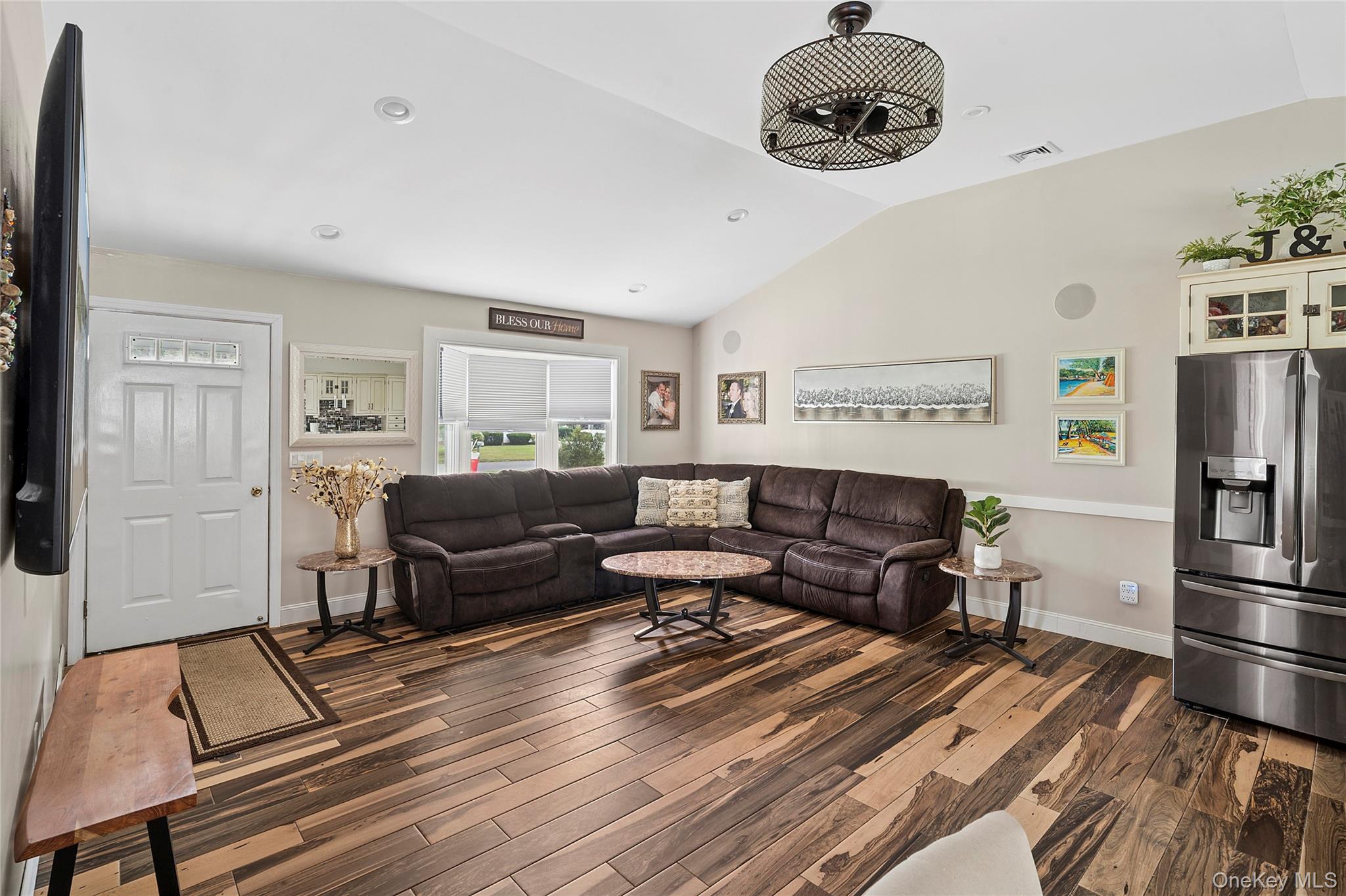 53 Timber Drive Calverton, NY 11933 - Photo 10 of 20 a living room with furniture and a chandelier