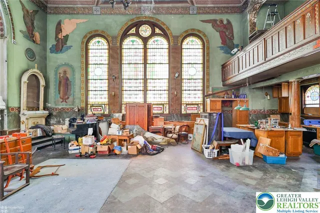 a view of hall way with furniture