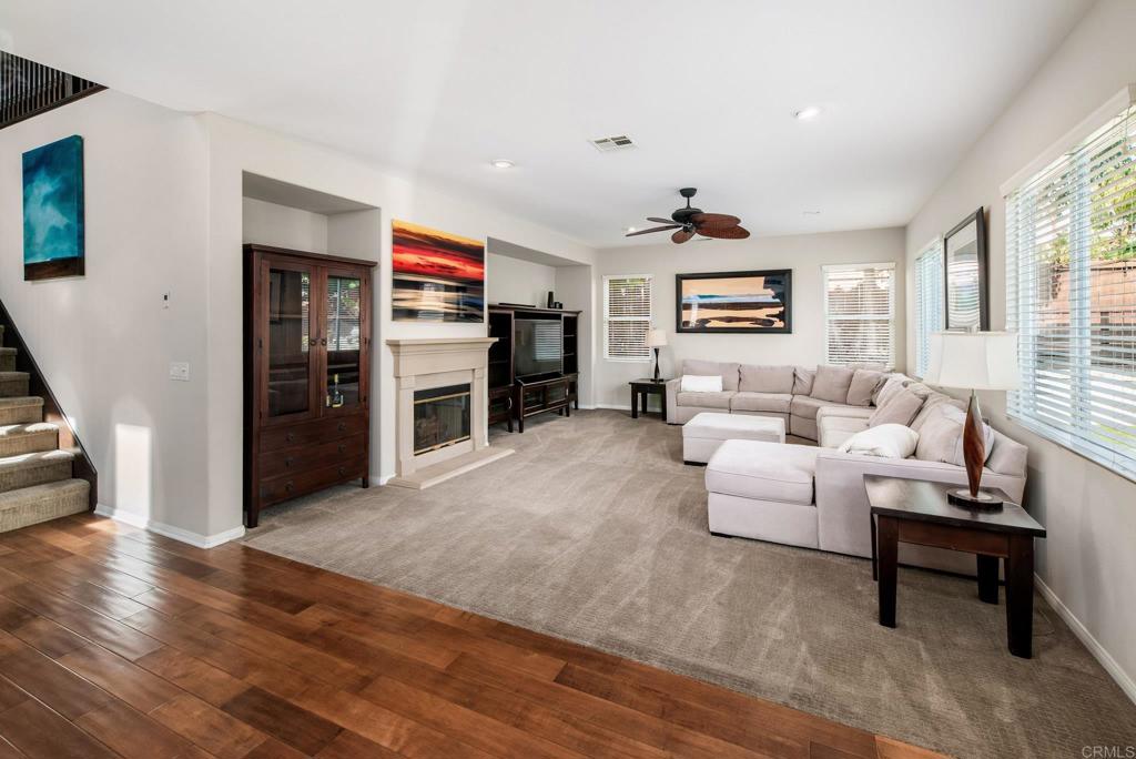 3434 Ravine Drive Carlsbad, CA 92010 - Photo 12 of 37 a living room with furniture and a flat screen tv