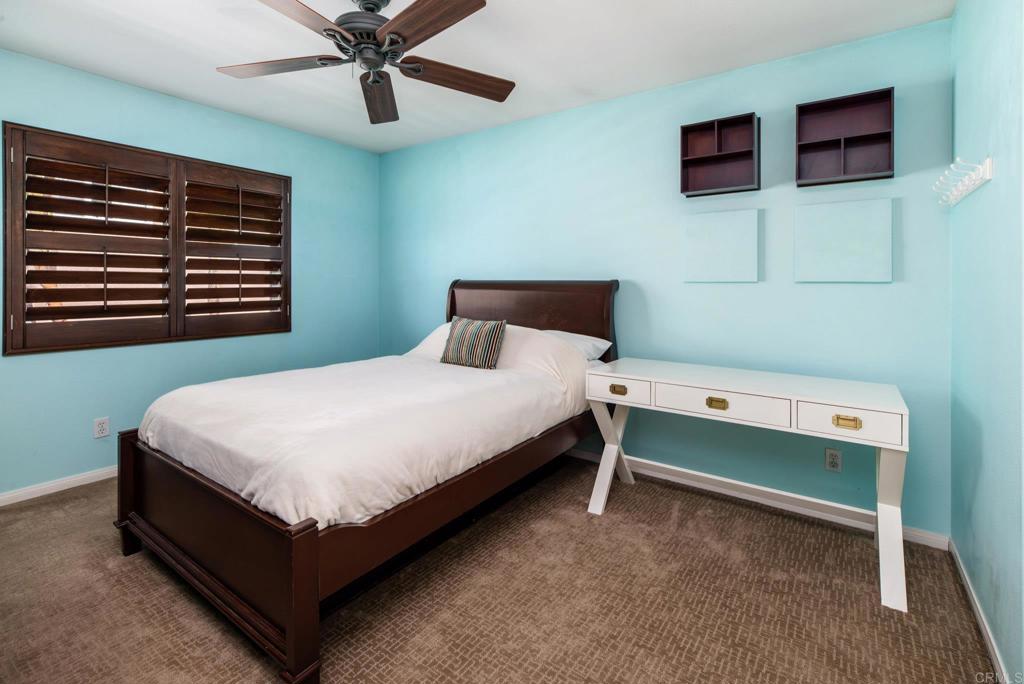 3434 Ravine Drive Carlsbad, CA 92010 - Photo 18 of 37 a bedroom with a bed and window