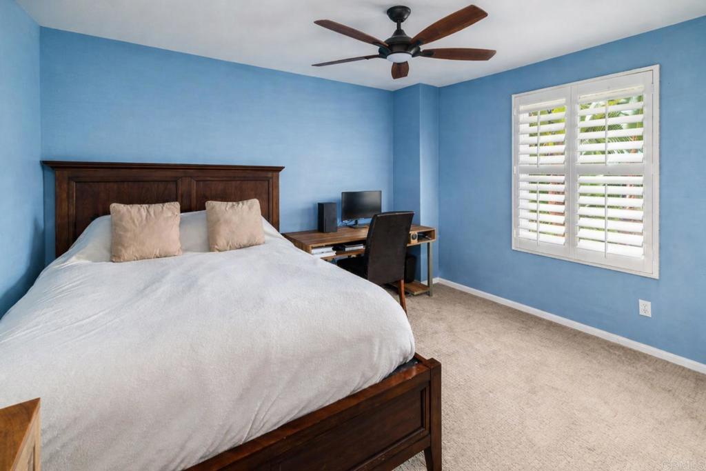 3434 Ravine Drive Carlsbad, CA 92010 - Photo 20 of 37 a bedroom with a bed and a window