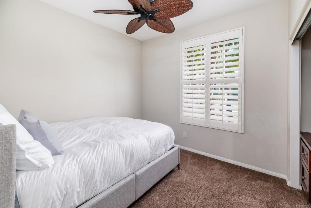 3434 Ravine Drive Carlsbad, CA 92010 - Photo 22 of 37 a bedroom with a bed and a window