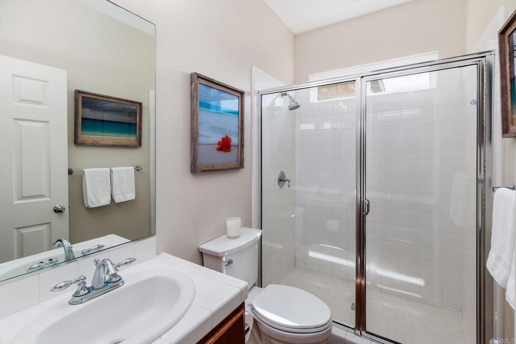 3434 Ravine Drive Carlsbad, CA 92010 - Photo 23 of 37 a bathroom with a sink toilet and shower