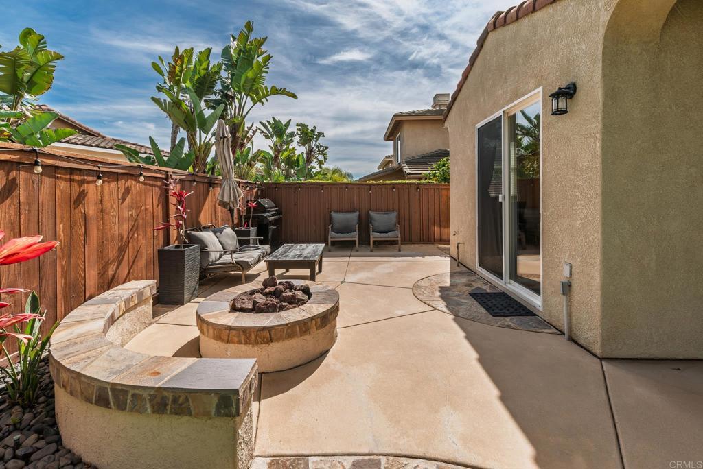 3434 Ravine Drive Carlsbad, CA 92010 - Photo 28 of 37 a dining room with furniture and a potted plant