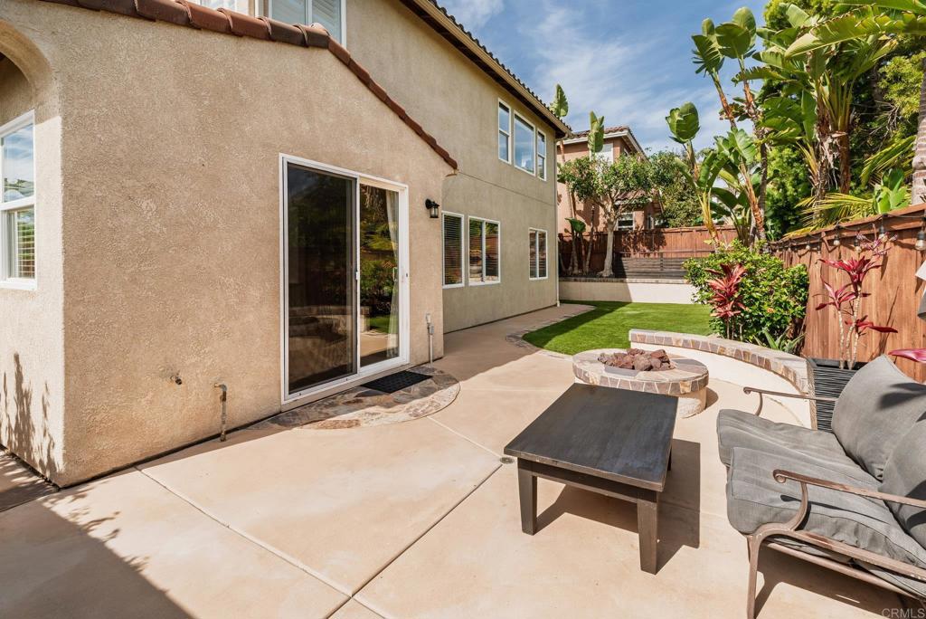 3434 Ravine Drive Carlsbad, CA 92010 - Photo 29 of 37 a backyard of a house with table and chairs