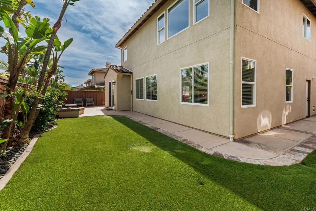 3434 Ravine Drive Carlsbad, CA 92010 - Photo 30 of 37 a view of a house with a yard and pathway