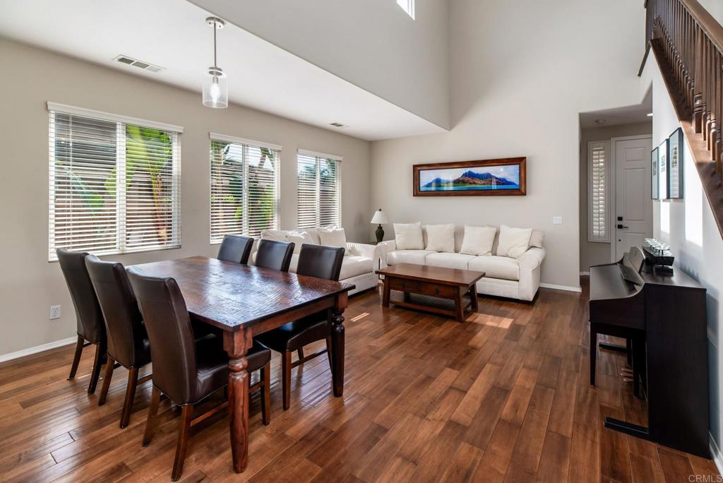 3434 Ravine Drive Carlsbad, CA 92010 - Photo 3 of 37 a living room with furniture dining table and a large window
