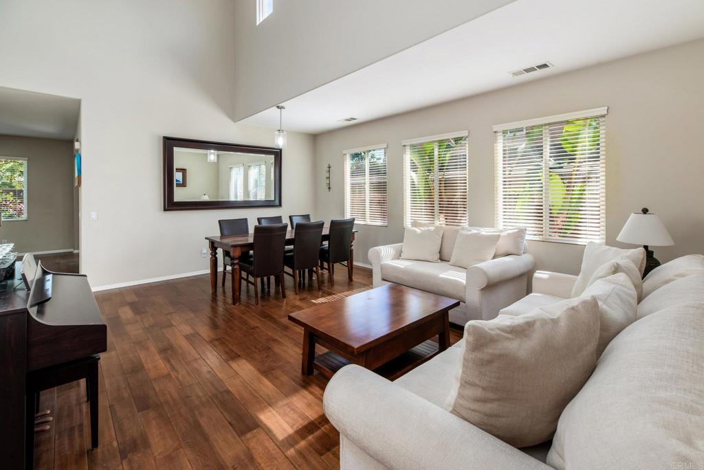 3434 Ravine Drive Carlsbad, CA 92010 - Photo 5 of 37 a living room with furniture and floor to ceiling windows