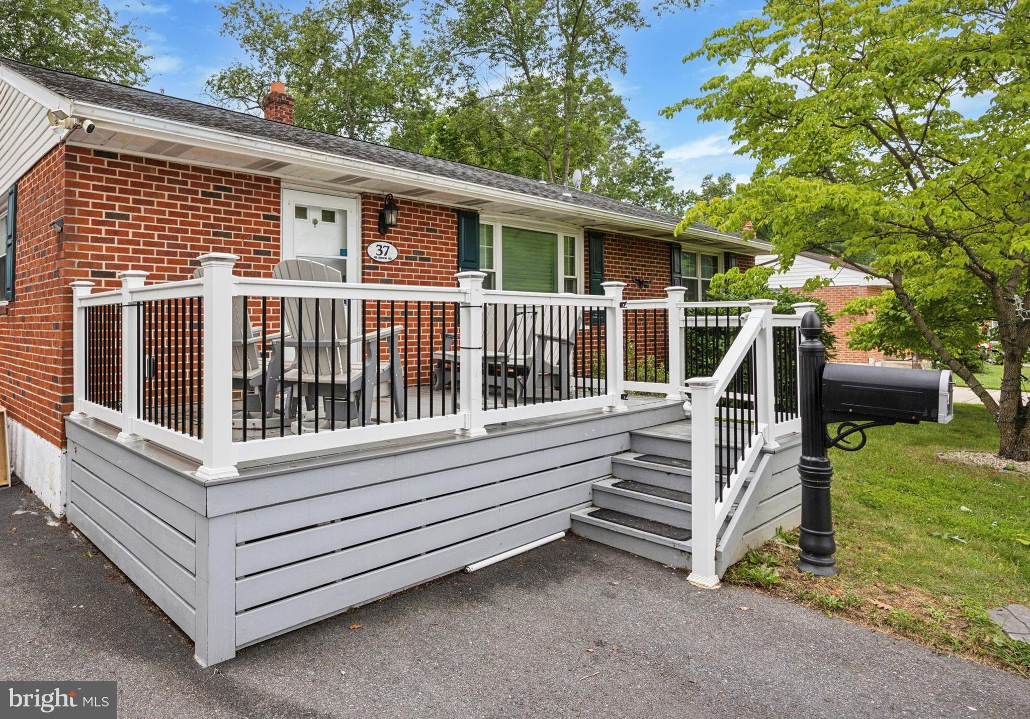 37 Millbrook Road Newark, DE 19713 - Photo 1 of 17 a view of house with a yard from a balcony