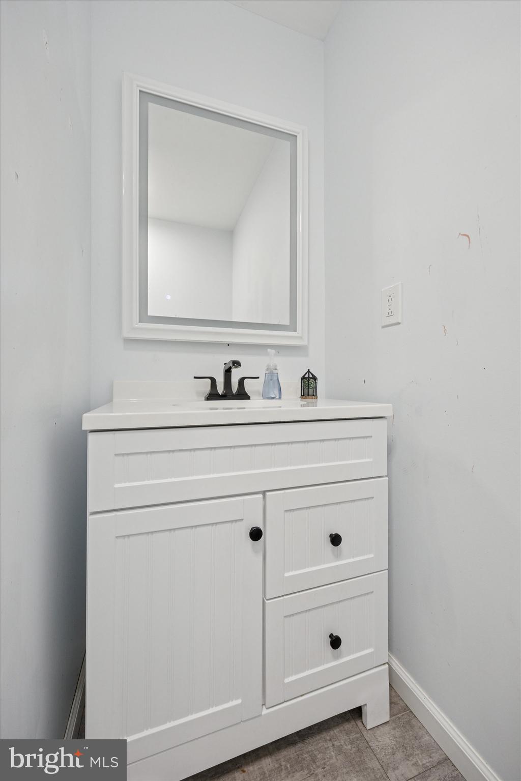 37 Millbrook Road Newark, DE 19713 - Photo 11 of 17 a bathroom with a sink a vanity and a mirror