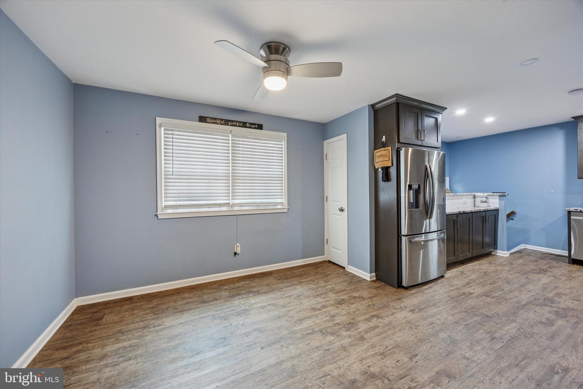37 Millbrook Road Newark, DE 19713 - Photo 5 of 17 a view of kitchen with refrigerator stove and wooden floor