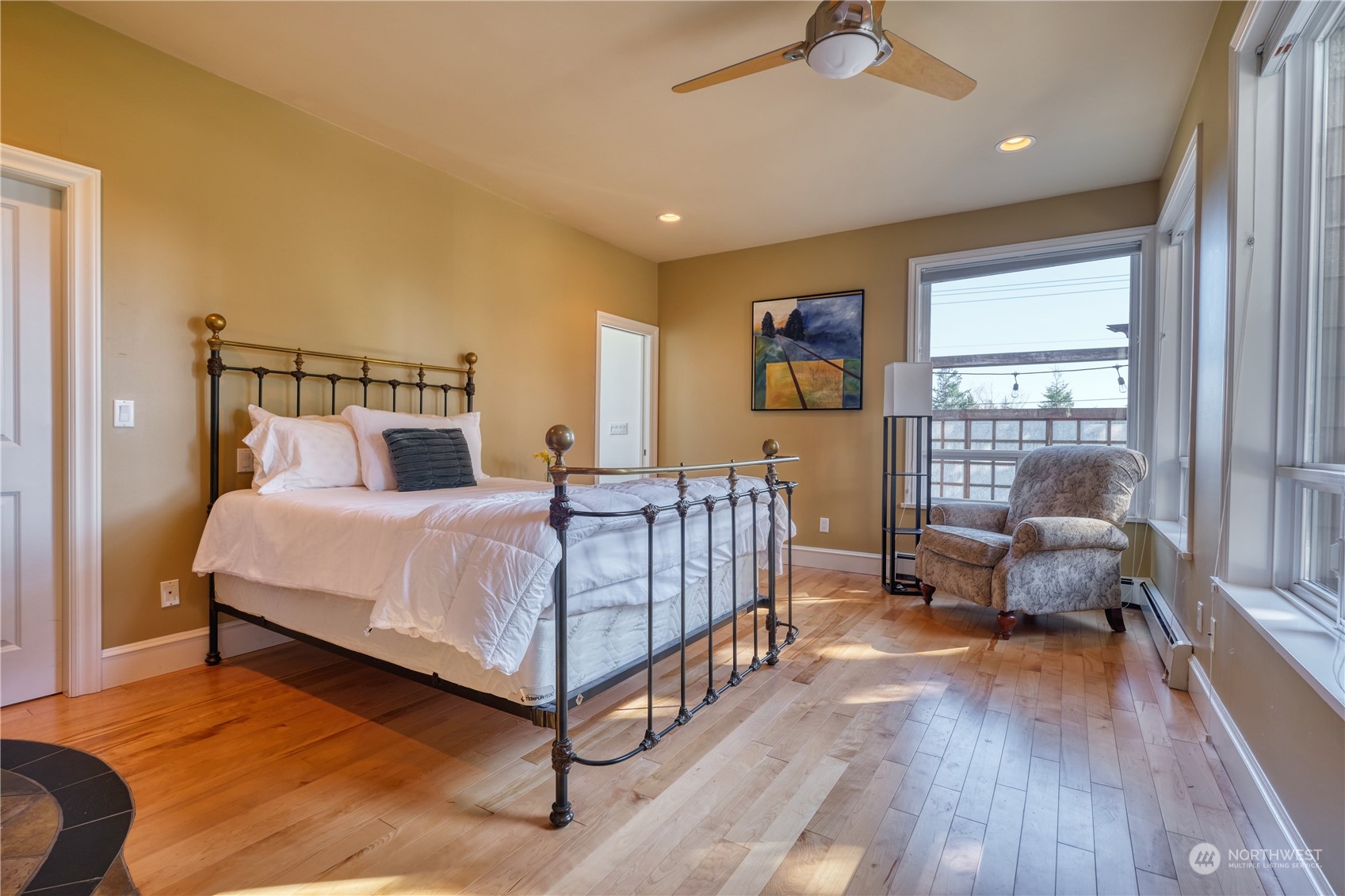 589 South Beach Road Point Roberts, WA 98281 - Photo 15 of 37 a bedroom with a bed and wooden floor