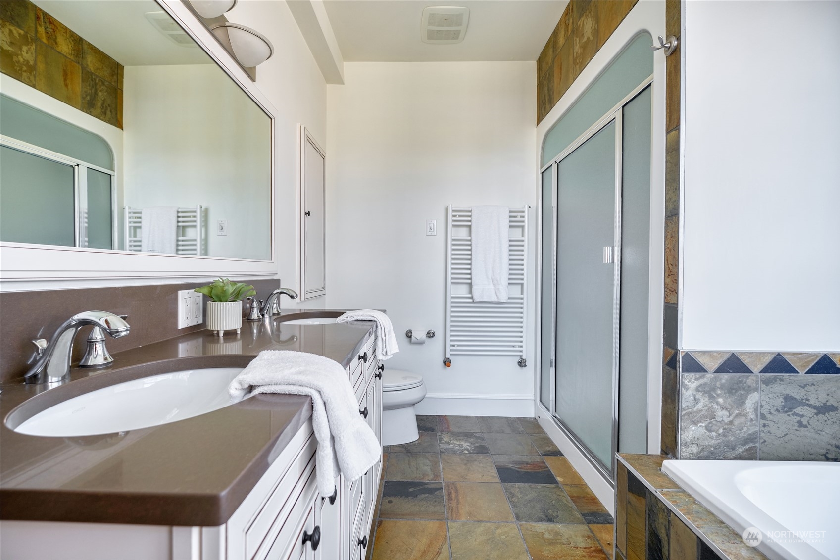 589 South Beach Road Point Roberts, WA 98281 - Photo 16 of 37 a en suite spacious bathroom with a double vanity sink and a mirror