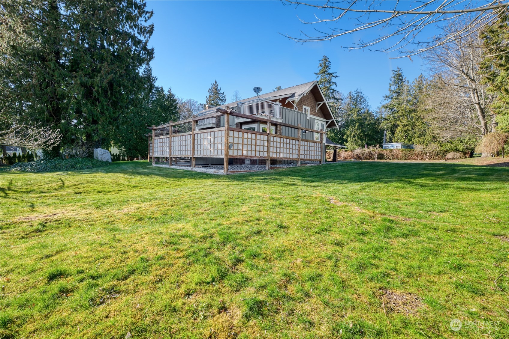 589 South Beach Road Point Roberts, WA 98281 - Photo 35 of 37 a view of a house with a big yard and large trees