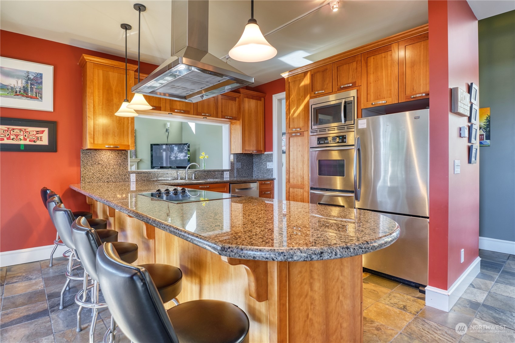 589 South Beach Road Point Roberts, WA 98281 - Photo 6 of 37 a kitchen with stainless steel appliances granite countertop a dining table chairs and chandelier