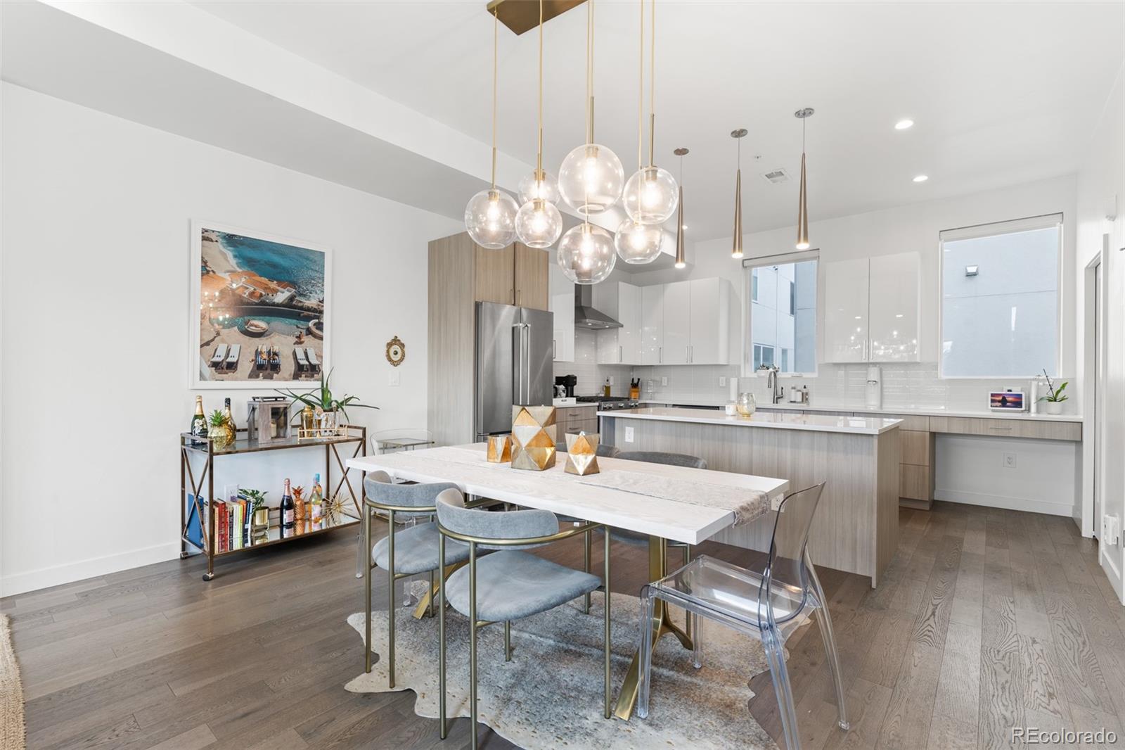 1608 Irving Street Denver, CO 80204 - Photo 15 of 37 a large kitchen with a table and chairs