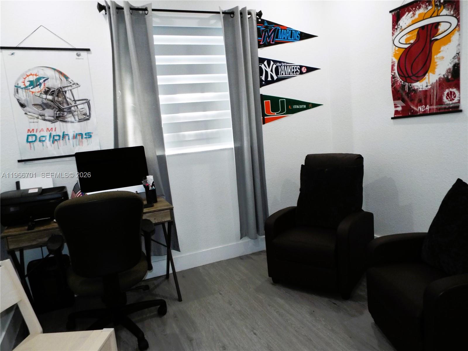 21470 Southwest 85th Path Cutler Bay, FL 33189 - Photo 25 of 50 a view of a workspace with furniture and wooden floor