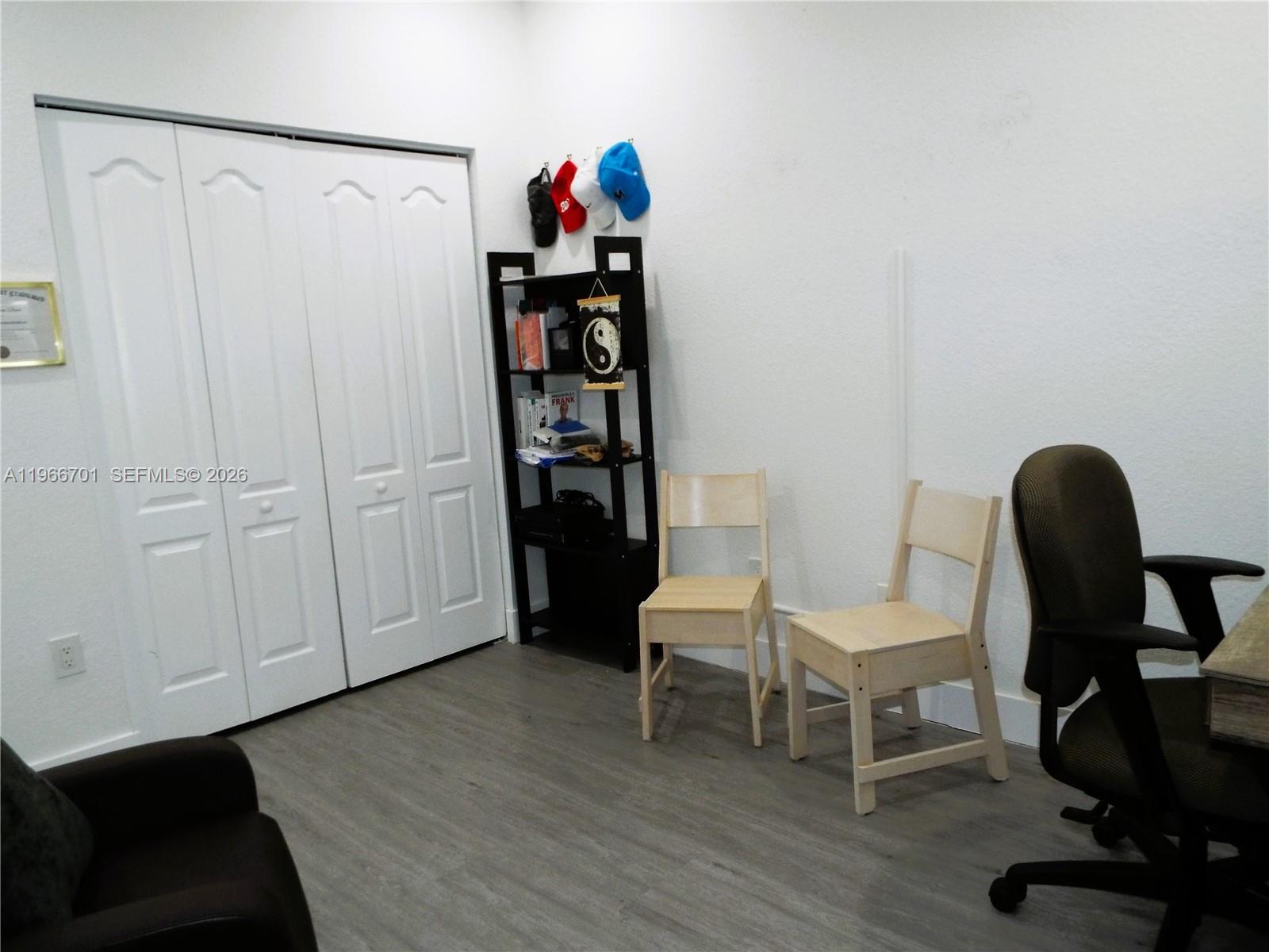 21470 Southwest 85th Path Cutler Bay, FL 33189 - Photo 26 of 50 a view of a workspace with furniture and wooden floor