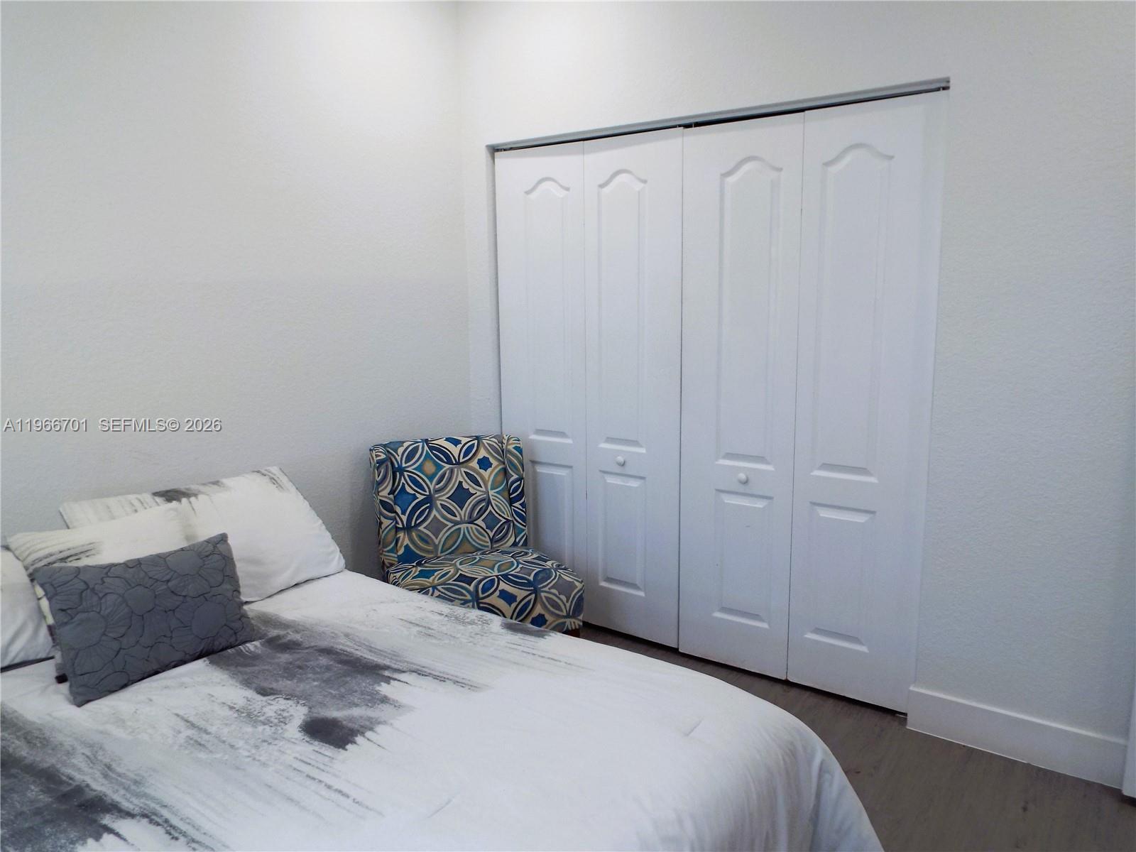 21470 Southwest 85th Path Cutler Bay, FL 33189 - Photo 30 of 50 a bedroom with a bed and a dresser