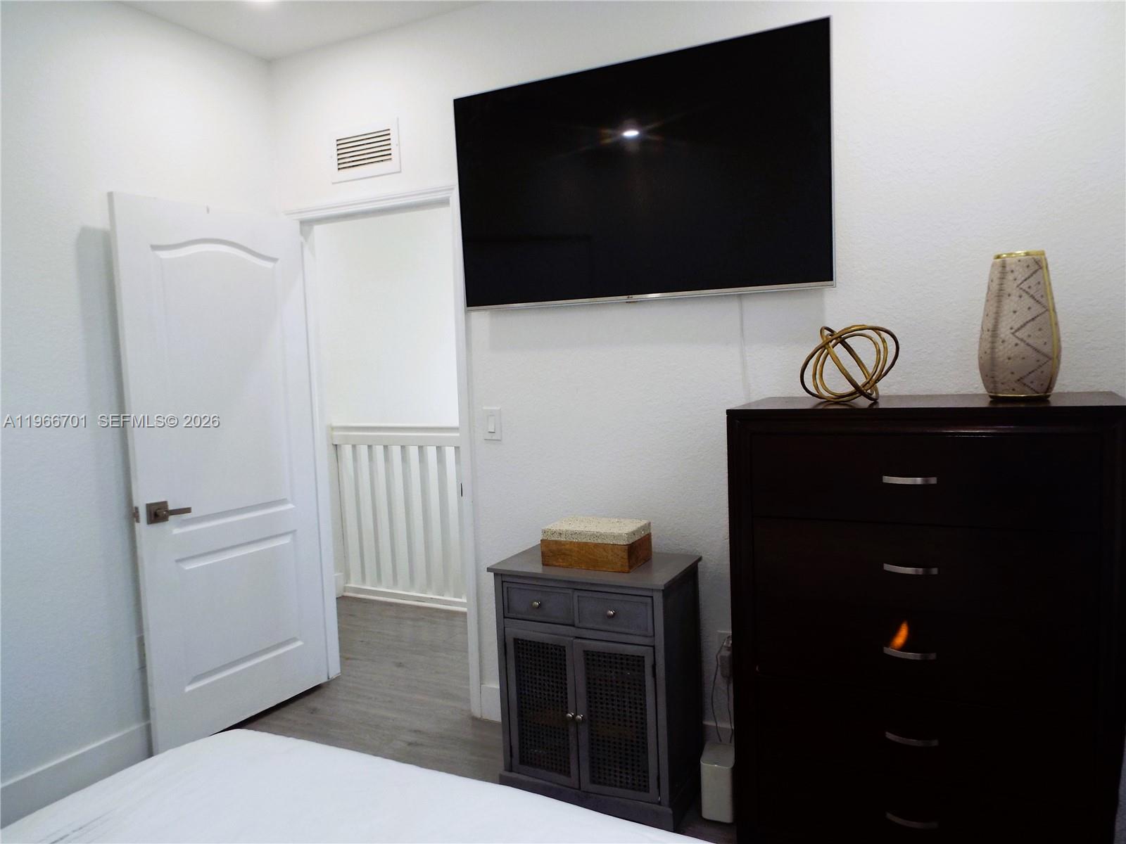 21470 Southwest 85th Path Cutler Bay, FL 33189 - Photo 31 of 50 a living room with furniture and a flat screen tv
