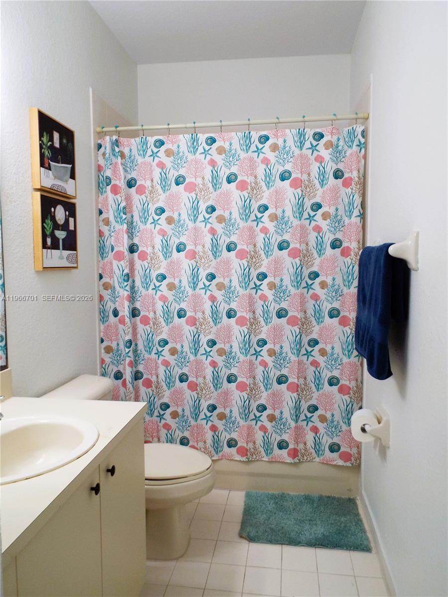 21470 Southwest 85th Path Cutler Bay, FL 33189 - Photo 34 of 50 a bathroom with a sink and a toilet