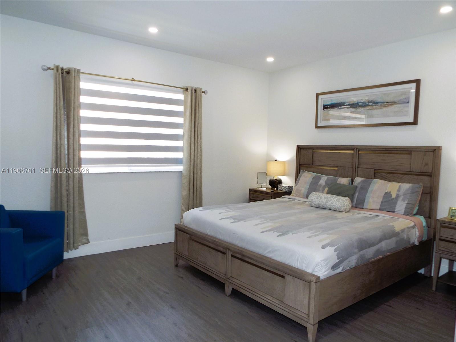 21470 Southwest 85th Path Cutler Bay, FL 33189 - Photo 36 of 50 a bedroom with a bed and window
