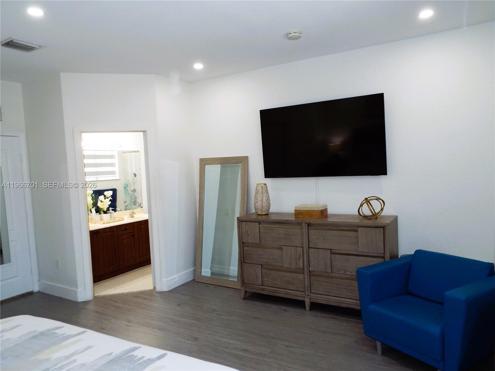 21470 Southwest 85th Path Cutler Bay, FL 33189 - Photo 39 of 50 a living room with furniture and a flat screen tv