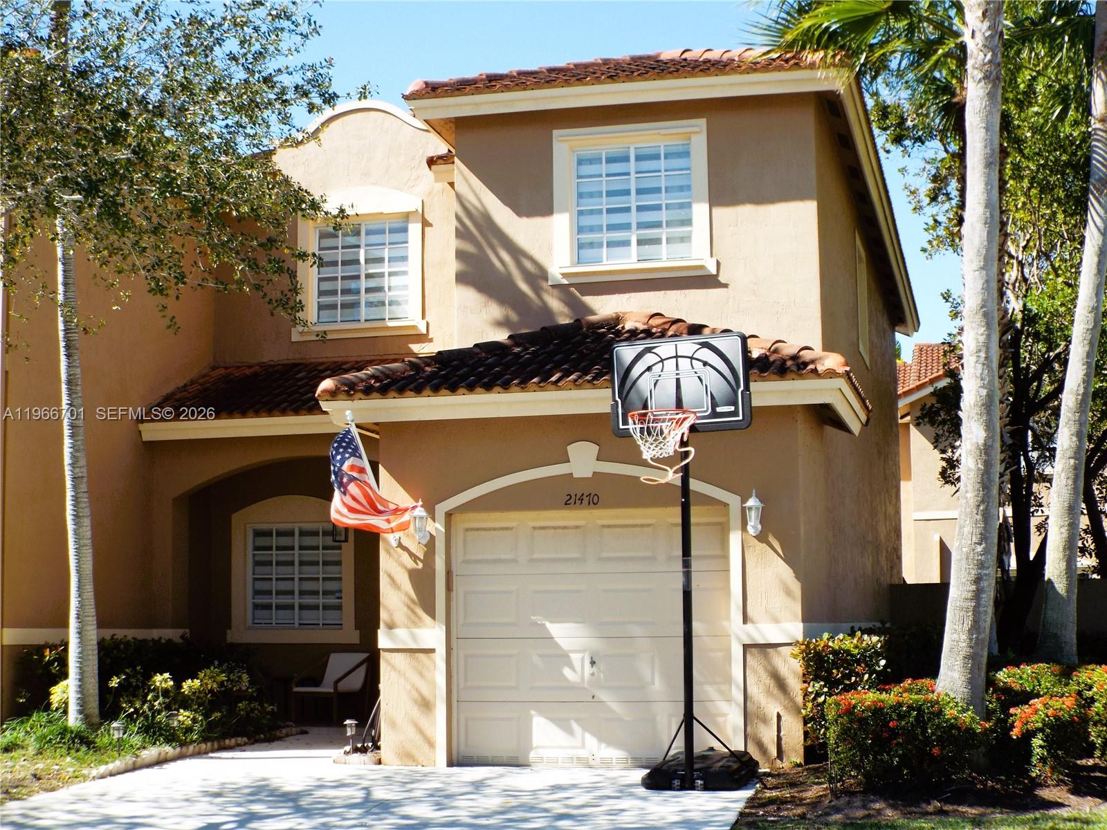 21470 Southwest 85th Path Cutler Bay, FL 33189 - Photo 49 of 50 a front view of a house with garden