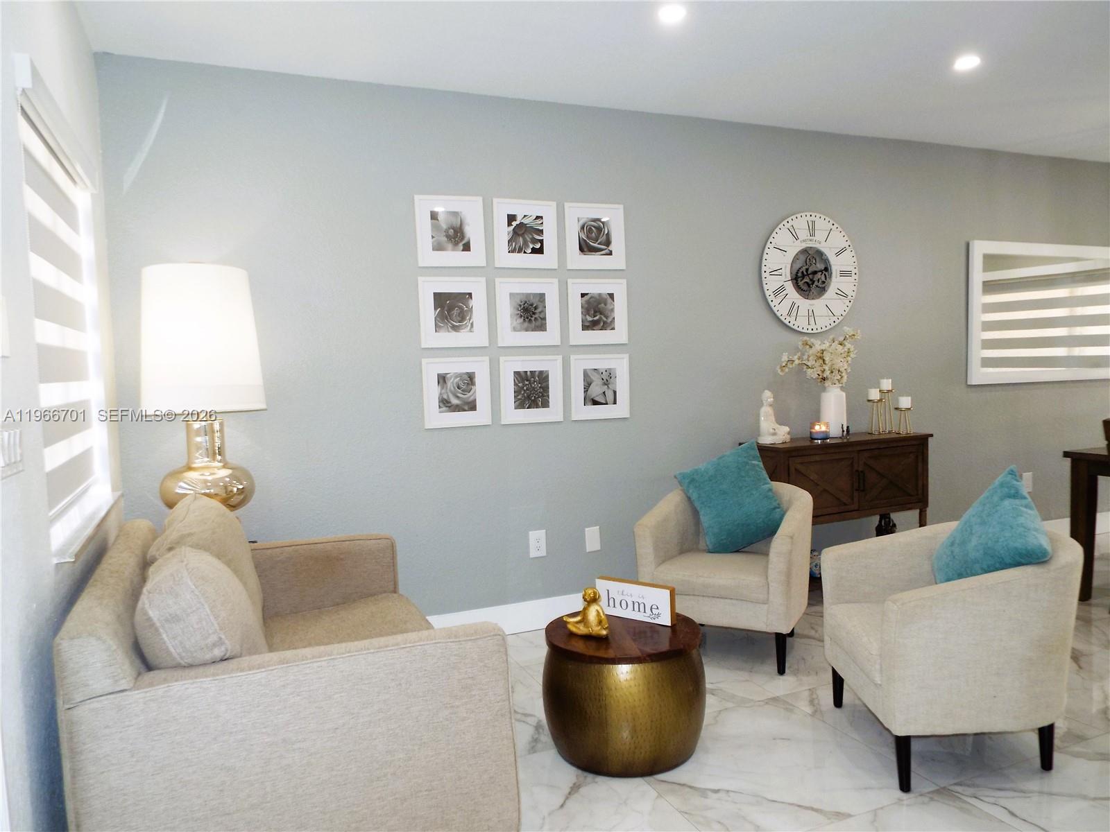 21470 Southwest 85th Path Cutler Bay, FL 33189 - Photo 7 of 50 a living room with furniture and decor