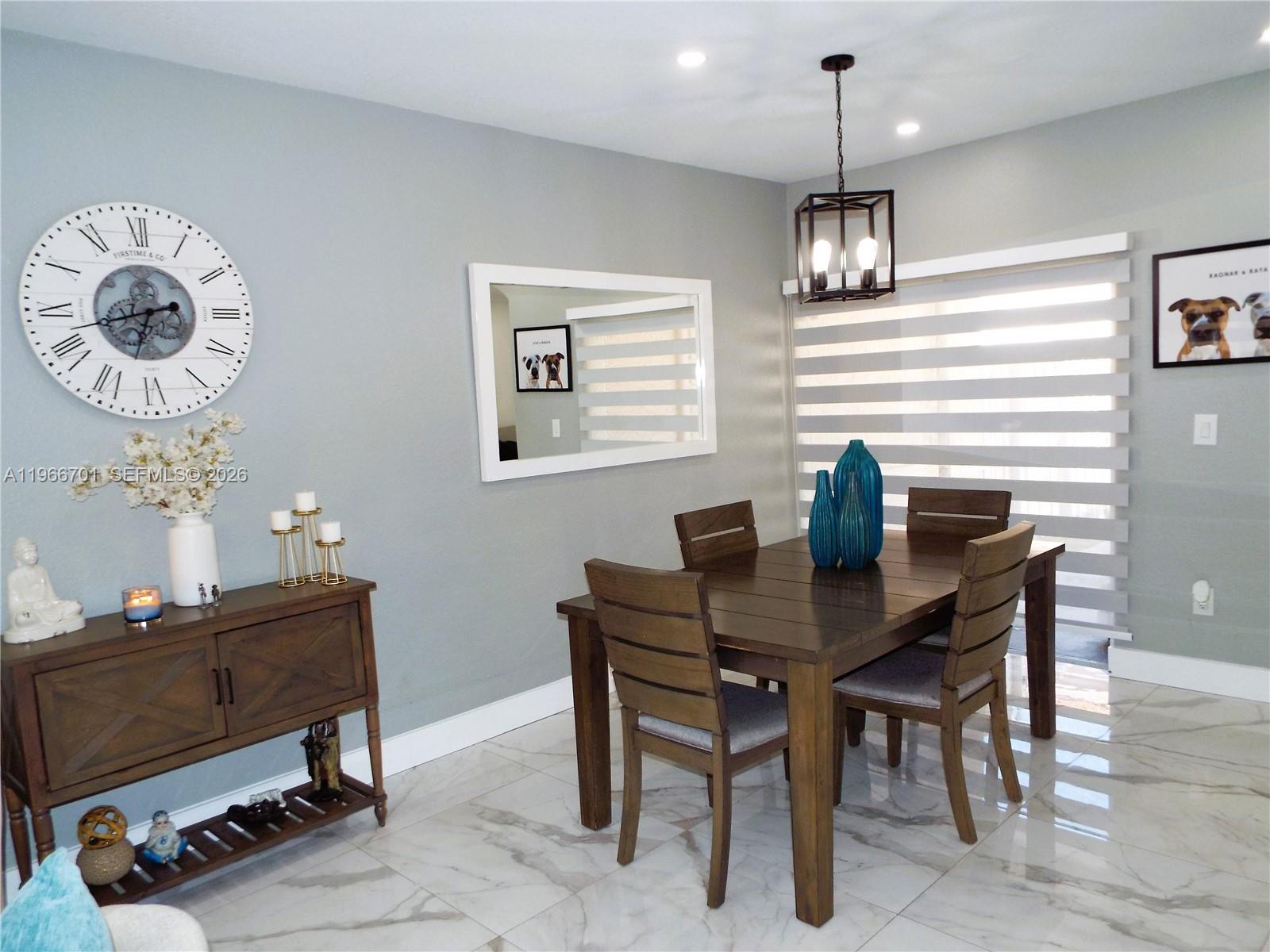 21470 Southwest 85th Path Cutler Bay, FL 33189 - Photo 8 of 50 a view of a dining room with furniture
