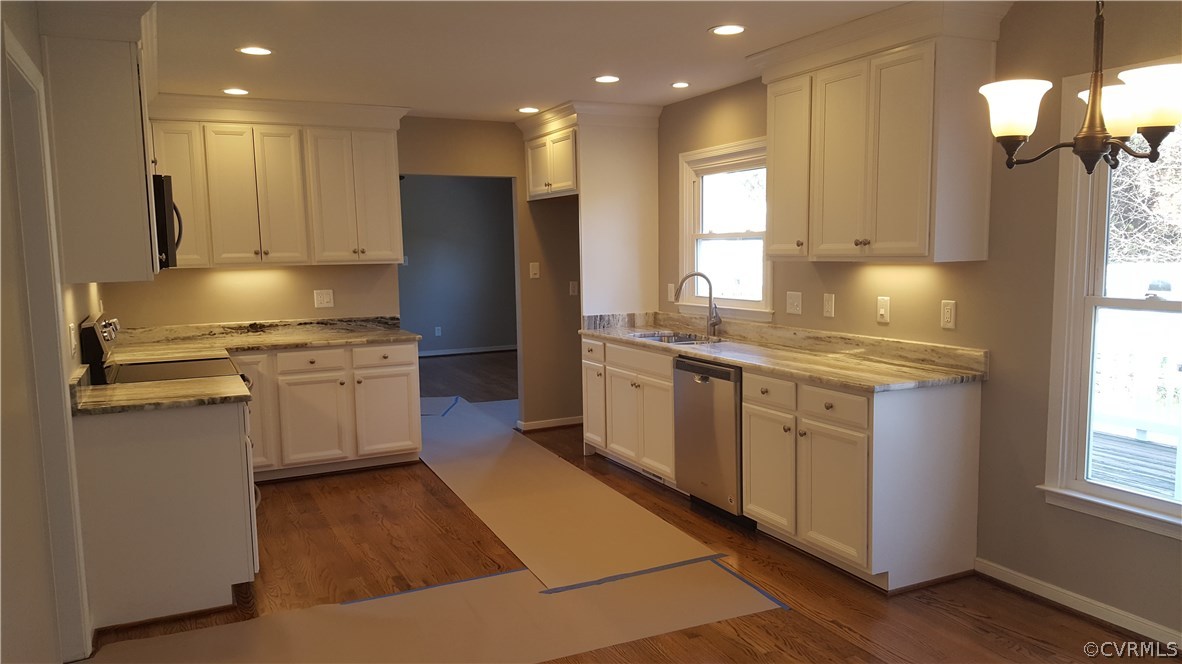 1613 Wilson Wood Road Midlothian, VA 23114 - Photo 11 of 37 a kitchen with a sink stove cabinets and refrigerator