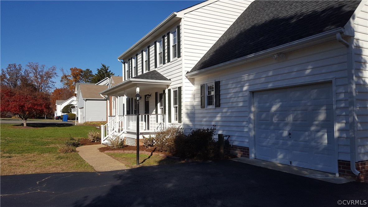 1613 Wilson Wood Road Midlothian, VA 23114 - Photo 2 of 37 a front view of a house with a yard