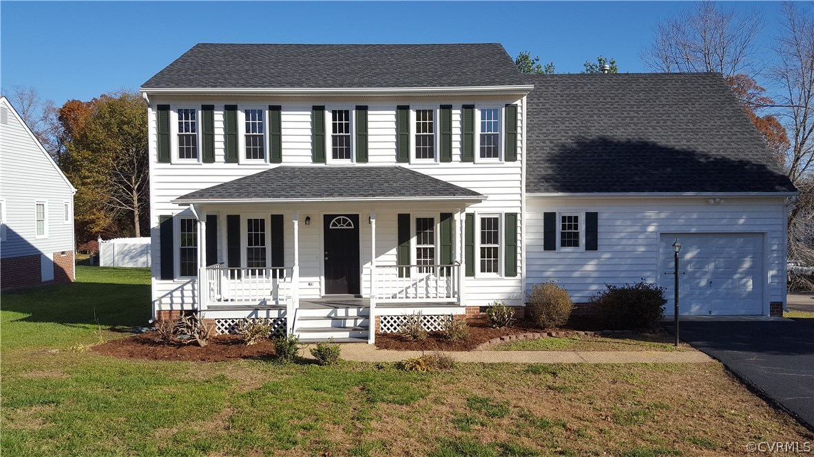 1613 Wilson Wood Road Midlothian, VA 23114 - Photo 32 of 37 a front view of a house with a yard table and chairs
