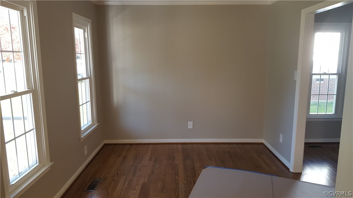 1613 Wilson Wood Road Midlothian, VA 23114 - Photo 5 of 37 an empty room with wooden floor and windows