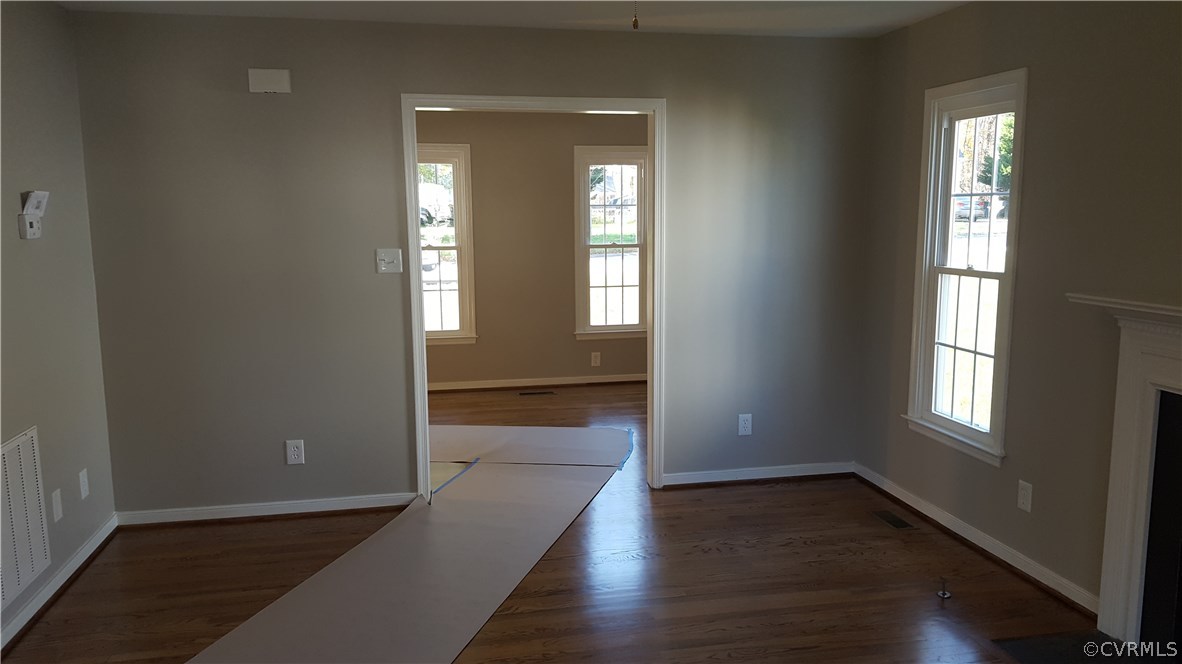 1613 Wilson Wood Road Midlothian, VA 23114 - Photo 8 of 37 an empty room with wooden floor and windows