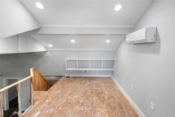 a view of a kitchen with a sink and a refrigerator