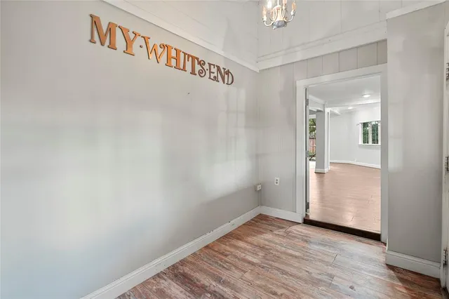 a view of washer and dryer with bathtub in a room