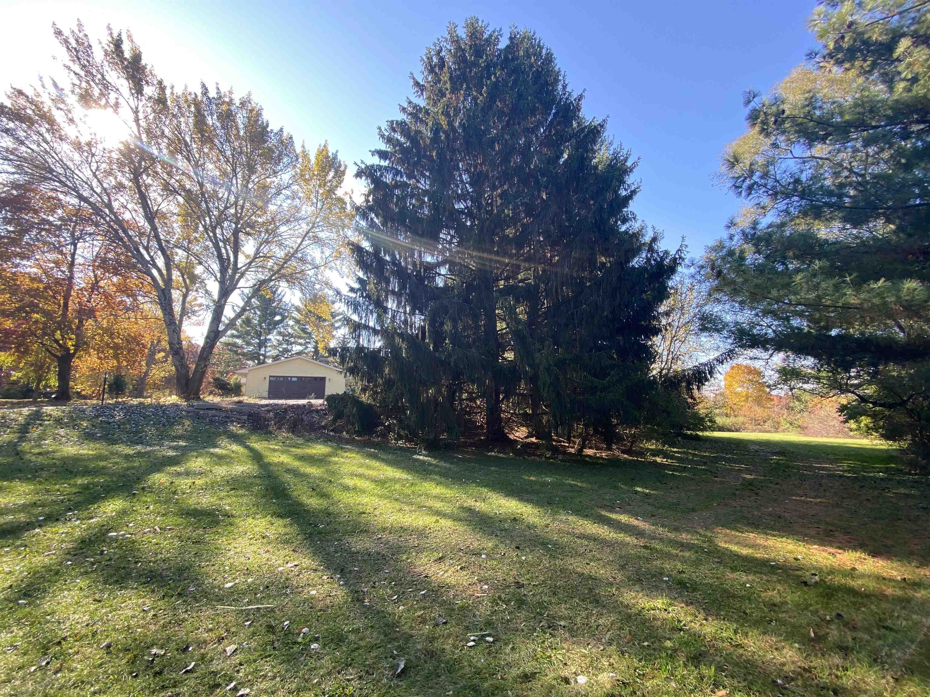 10414 Beaver Valley Road Belvidere, IL 61008 - Photo 6 of 20 a view of a yard with a house in the background