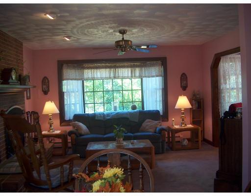 143 Colburn Road Charlton, MA 01507 - Photo 8 of 27 a living room with furniture and a large window