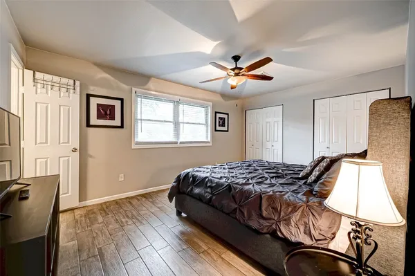 a bedroom with bed and window