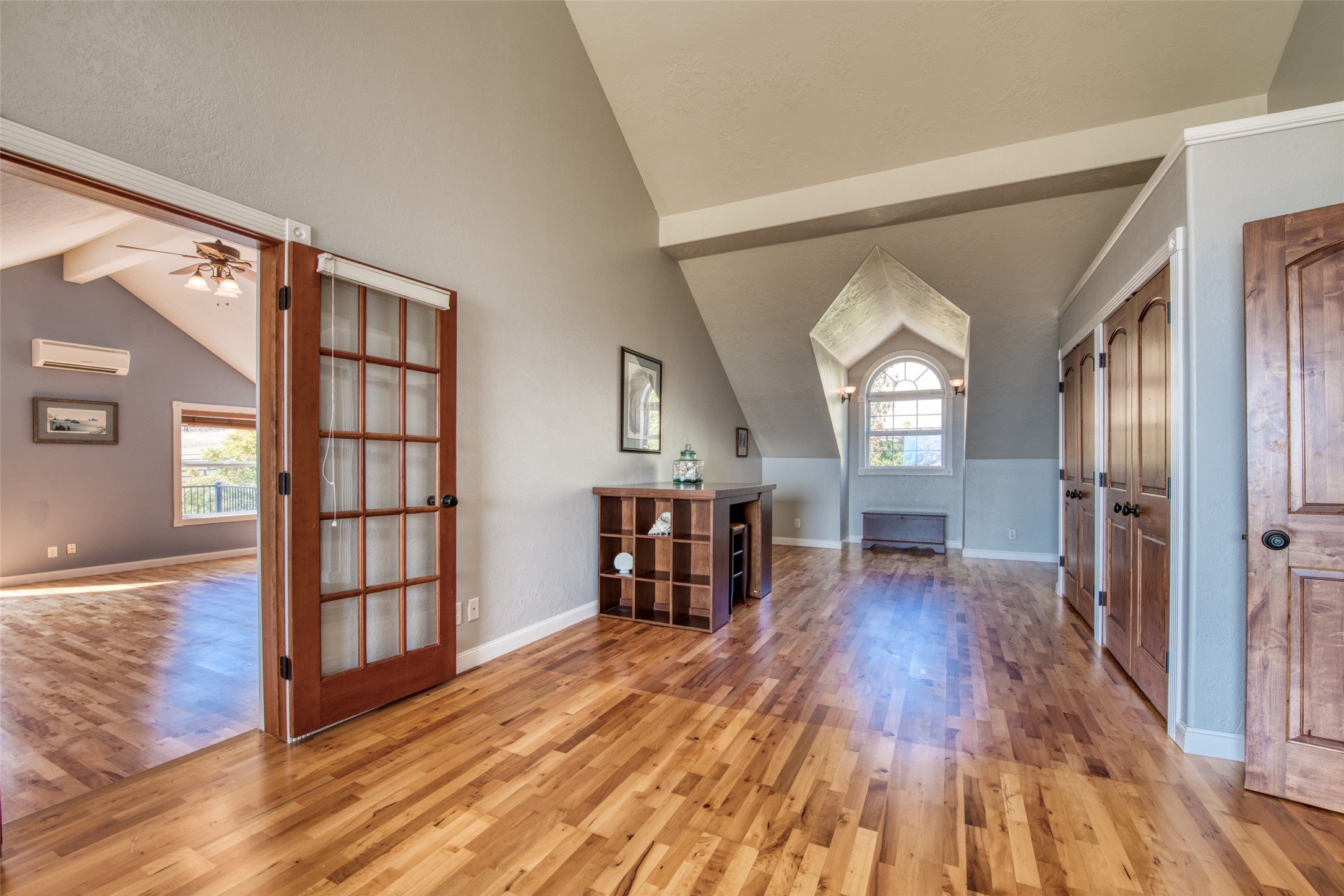 16374 Folsom Road Florence, MT 59833 - Photo 67 of 98 Entrance foyer featuring light wood-style flooring, a wall unit AC, and a ceiling fan